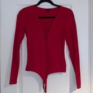 Red lace-up body suit